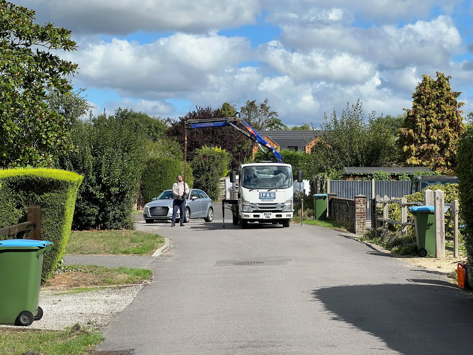 IP&G operative working the lorry crane on a residential street
